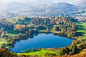 Loughrigg Tarn viewed from Loughrigg Fell in the Lake District National Park. Cumbria. England.