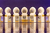 UAE, Abu Dhabi, Sheikh Zayed bin Sultan Mosque, arches, dusk.