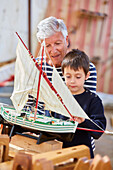 Grandfather and grandson, Building model sailboat, Whaleship, Pasaia, Gipuzkoa, Basque Country, Spain, Europe