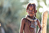 Himba girl with traditional hairstyle and jewelery, Kunene, Namibia, Africa