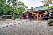 Japanese praying in front of Nezu-Shrine, Yanaka, Taito-ku, Tokyo, Japan