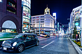 Crossing with cars at Wako Building in Ginza during blue hour, Chuo-ku, Tokyo, Japan
