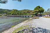Wooden bridge over river Katsura in Arashiyama, Kyoto, Japan