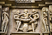KANDARIYA MAHADEV TEMPLE: South Wall - Lower Panel - Mithuna Couple, Western Group, Khajuraho, Madhya Pradesh, India, UNESCO World Heritage Site.