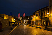 'Houses and shops on Boyuk Qala Street at night; Baku, Azerbaijan'