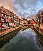 Panorama of colored houses reflected in River Lauch at sunset, Petite Venise, Colmar, Haut-Rhin department, Alsace, France, Europe