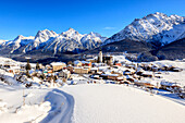 Blue sky on the alpine village of Ftan surrounded by snow, Inn district, Canton of Graubunden, Engadine, Swiss Alps, Switzerland, Europe