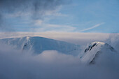 Mountain breaking through the clouds, Elephant Island, South Shetland Islands, Antarctica, Polar Regions