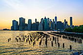 Lower Manhattan skyline across the East River at sunset, New York City, New York, United States of America, North America