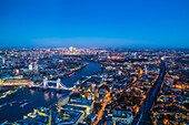 High view of London skyline at dusk along the River Thames from Tower Bridge to Canary Wharf, London, England, United Kingdom, Europe