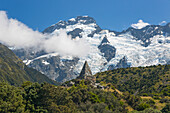 Alpine memorial dwarfed by Mount Sefton, Aoraki (Mount Cook National Park, UNESCO World Heritage Site, Mackenzie district, Canterbury, South Island, New Zealand, Pacific
