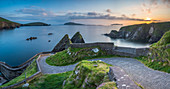 Dunquin pier D+¦n Chaoin, Dingle peninsula, County Kerry, Munster province, Ireland, Europe, Panoramic view of the trail at sunset