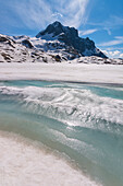 Europe, Italy, thaw at vacca Lake, Adamello park, province of Brescia
