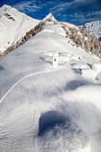 The wind moves the floury snow at Alpe Scima, Valchiavenna, Valtellina Lombardy, Italy Europe