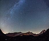 Starry sky over Mont Blanc range seen from Lac de Chesery, Haute Savoie, France
