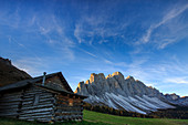 The early morning light illuminates Malga Zannes and the Odle in background, Funes Valley South Tyrol Dolomites Italy Europe