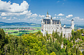 Neuschwanstein castle surrounded by woods Fussen Bavaria southern Germany Europe