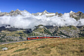 The Bahn train on its route with high peaks and mountain range in the background Gornergrat Canton of Valais Switzerland Europe