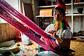 Inle Lake, Myanmar, South east Asia, Padaung tribe woman working at the loom