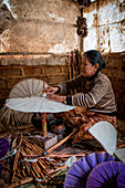 Myanmar, South East Asia, A small workshop where they build umbrellas made of wood and paper