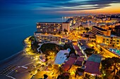 Panoramic landscape at dusk beaches, hotels and the Carihuela, Torremolinos. Malaga province Costa del Sol. Andalusia Southern Spain, Europe.