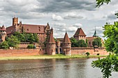 The Castle of the Teutonic Order in Malbork (Zamek w Malborku), is a castle on the river Nogat. From 1309 to 1454, the castle was seat of the Grand Master of the Teutonic order in the State of the Teutonic Order. The castle complex is the largest brick bu