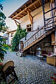Courtyard of house in Historic Centre of Sighisoara city, Transylvania region in Romania.