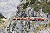 The little train of Artouste is the highest passengers train of Europe and run from Artouste town to alpine lake of Artouste on August 14, 2016 Ossau valley South of France.