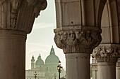 Afternoon in the sestier of San Marco, Venice, Italy. Santa Maria della Salute church in the distance.