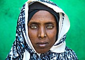 Portrait of an Afar tribe woman with green eyes and tattoos on her face, Afar region, Assaita, Ethiopia.
