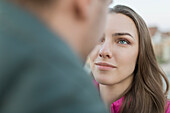 Close-up of young woman looking at man