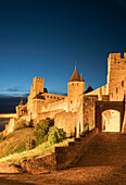 Road to castle at night in Carcassonne, Languedoc-Roussillon, France