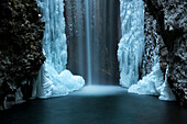 Waterfall from Smeraldo lake in winter, Non Valley, Trentino Alto Adige, Italy