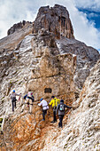 Climbers on via ferrata Marino Bianchi on Mount Cristallo di Mezzo, Cortina d'Ampezzo, Belluno district, Veneto, Italy, Europe