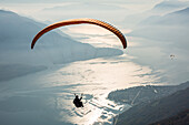 Paragliding over Lake Como and the surroundings mountains, Alto Lario, Como, Lombardy, Italy, Europe