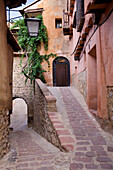 Albarracin, Aragon, Spain, The alleys wind through the walls of the houses irregular reddish