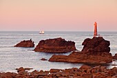 The Jument lighthouse at sunrise, off the island of Ouessant, France
