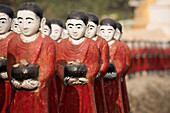 Rakhine state, Myanmar, Monks statues lined up in a pagoda