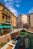 Venice, Veneto, Italy, Gondola sailing through a street canal