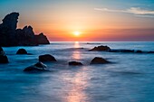 Zambrone, Calabria, Italy, Sunset on the beach of Capo Cozzo in Calabria with the Lion Rock