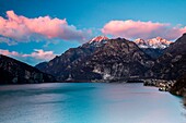 Sunset on the peaks of Codera valley from the lake of Novate Mezzola, Valchiavenna, Lombardy Italy Europe