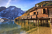 Wooden hut in the autumn landscape of Lake Braies Natural Park of Fanes Sennes Bolzano Trentino Alto Adige Italy Europe