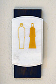 United Arab Emirates, Abu Dhabi skyline, close-up on a toilet signs