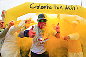 France, Calais, Pas de Calais (62), Holi Run. Marathon. The contestants are running with a white shirt and colored powder is splitting on them