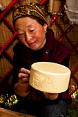 Kyrgyzstan, Issyk Kul Province (Ysyk-Kol), Juuku valley, thanks to a Swiss cooperation, Nurgul has learned how to make cheese