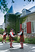 Canada. Province of Quebec. Montreal. Old town. Bag pipers in front of Ramezay castle built in 1756. Today, History Museum