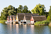 Traditional boathouses at the lake Mirower See, Mecklenburg lakes, Mecklenburg lake district, Mirow, Mecklenburg-West Pomerania, Germany, Europe