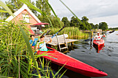 boathouses at Granzower Möschen, canoe tour, holiday, summer, swimming, sport, red boat, boats, Mecklenburg lakes, Mecklenburg lake district, Granzow, Mecklenburg-West Pomerania, Germany, Europe