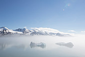 Small icebergs in the mist at Liefdefjorden, Spitzbergen, Svalbard