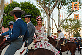 horseriding couple at the Feria de Abril, Seville Fair, spring festival, Sevilla, Seville, Andalucia, Spain, Europe